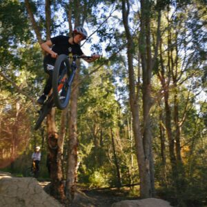 man riding bicycle on forest during daytime